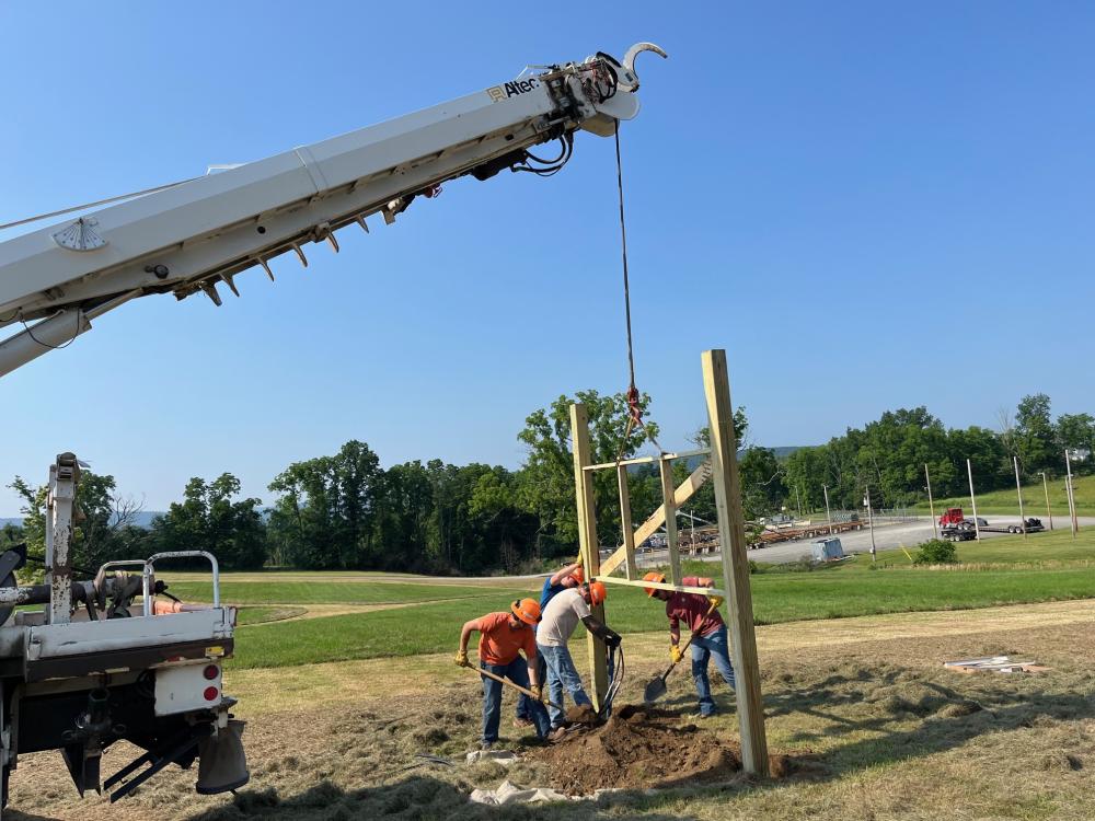 Equipment lifting frame into place