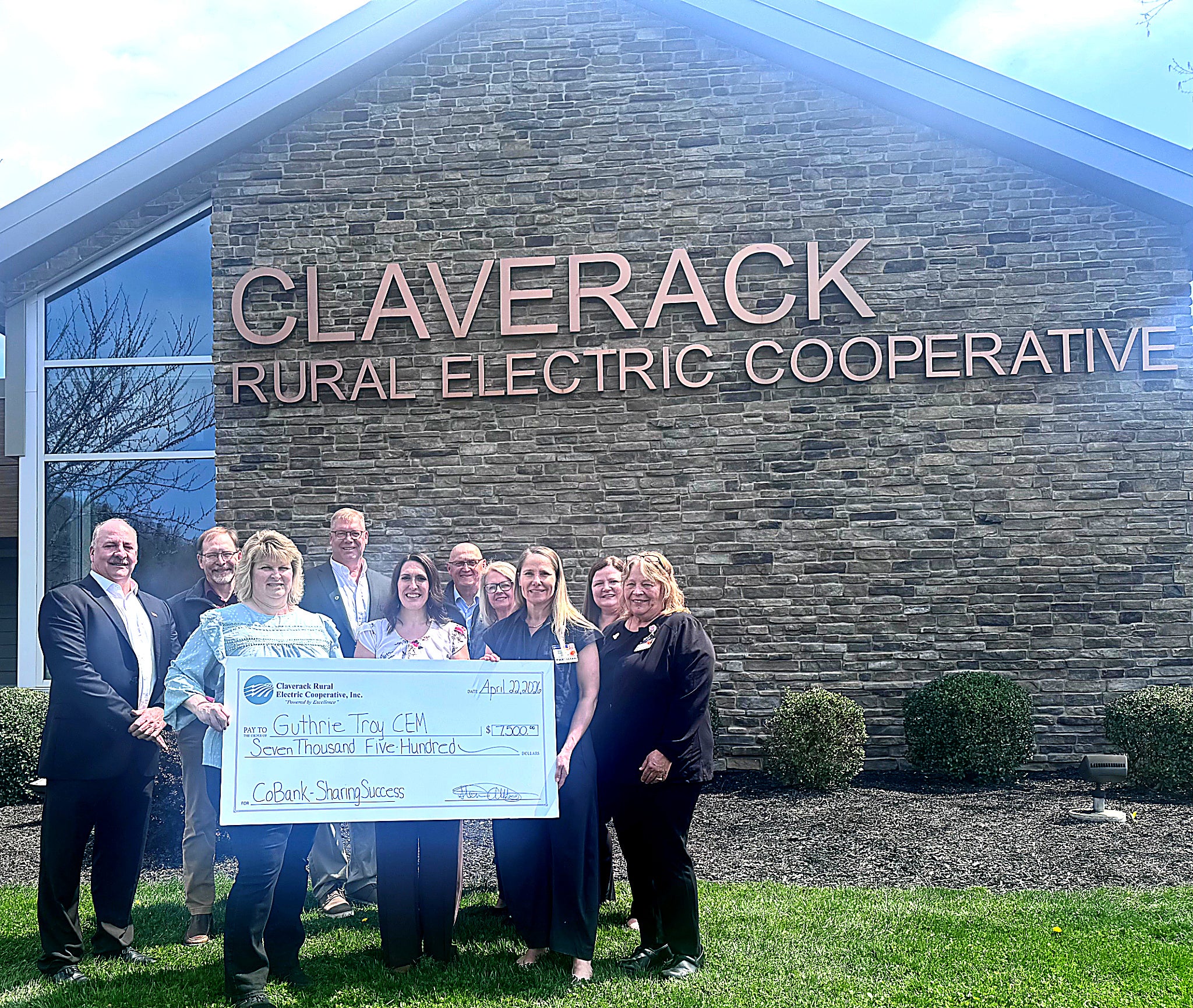 Claverack Rural Electric Cooperative directors and staff present a $7,500 Community Services Grant Program donation to members of Guthrie Troy Community Hospital. The funding will support the purchase of enhanced breast-imaging services, including the addition of contrast-enhanced mammography technology. The contribution was matched by CoBank through its Sharing Success Program, amplifying the impact for patients across the region. In front, from left, are Claverack Vice Chair Angela S. Joines (Z3); Guthrie Director of Operations and Nursing Services Amber King; Chair of Radiology Dr. Geneva Ballard; and Radiology Manager Pam Sherman. In back, from left, are Claverack Chair Timothy Tewksbury (Z6); Claverack President & CEO Steven Allabaugh; Director Dr. Robert Faux (Z2); Director Gary Hennip (Z4); Guthrie Resource Development Representative Patty Dawsey; and Director of Resource Development Tricia Huston. 16B P
